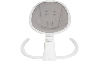 A top-down view of a modern baby rocker seat with a white frame and light gray padded fabric inside. The seat has built-in harness slots and two curved white legs extending forward, designed for stability and gentle rocking.